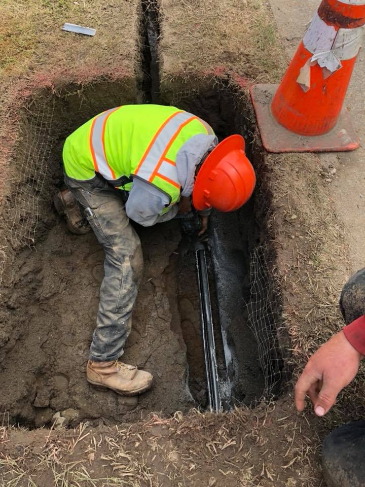 Worker in excavation pit
